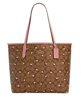 Coach Borough bags with a structured silhouette and a magnetic - snap closureCoach City Tote in Signature Canvas With Heart Floral Print