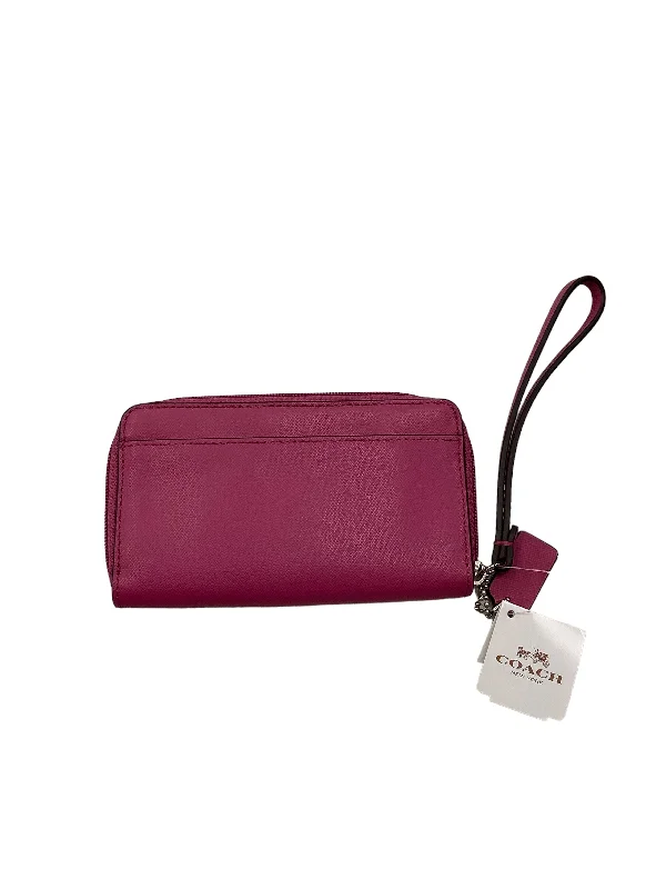 Coach Rogue bags with a monogram - embossed leather surfaceWristlet Leather By Coach  Size: Small