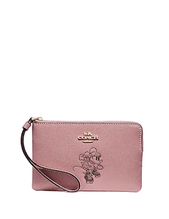 Ladies Coach shoulder bags with a tassel - decorated zipper for added charmCoach Corner Zip Wristlet With Minnie Mouse Motif