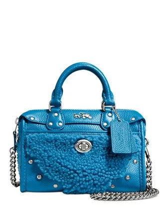 Coach Borough bags with a removable interior organizerCoach Rhyder Satchel 18 In Shearling and Leather