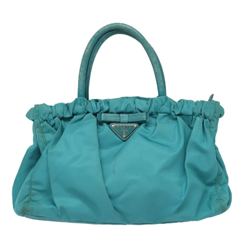 Prada Cleo bags with a contrast - colored interior for visual interestPRADA Hand Bag Nylon 2way Turquoise Blue  83957