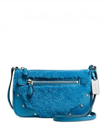 Coach handbags with a beaded trim for a glamorous and elegant lookCoach Small Rhyder Pochette in Shearling