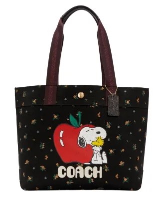 Coach bags with a patent - leather finish for a shiny and sophisticated appearanceCoach X Peanuts Tote With Snoopy