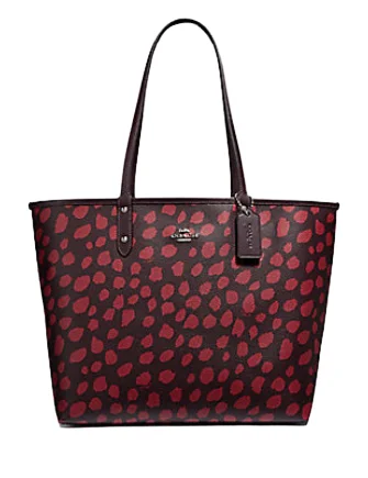 Coach tote bags with a spacious interior and multiple compartments for organizationCoach Reversible City Tote With Deer Spots