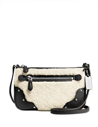 Small - sized Coach crossbody bags in smooth pebble leather for a compact carryCoach Small Rhyder Pochette in Shearling