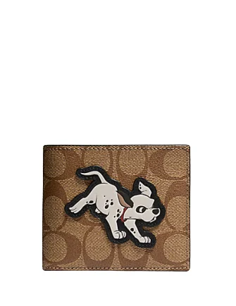 Coach Dempsey bags with a contrast - colored interior for visual interestCoach Disney X 3 in 1 Wallet in Signature Canvas With Dalmatian