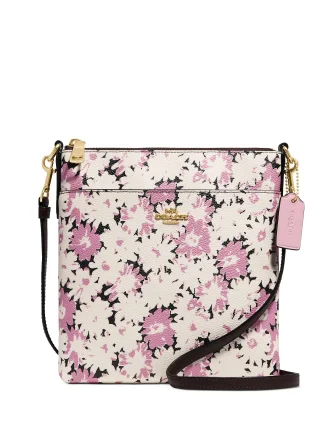 Coach Rogue bags featuring the signature C - hardware for a branded lookCoach Daisy Print Kitt Crossbody