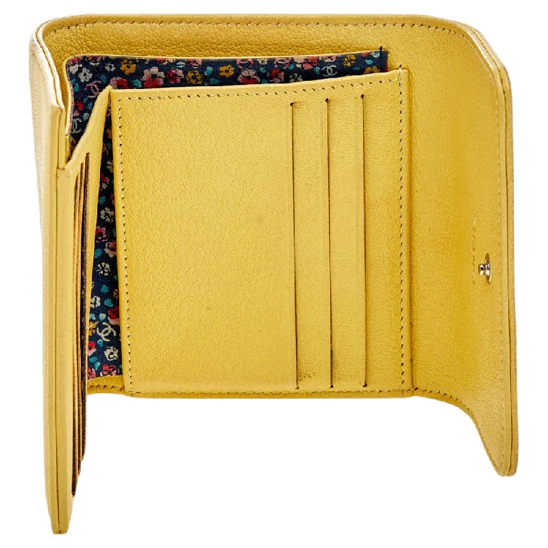 Chanel bags with exclusive seasonal designs and materialsCHANEL Yellow Leather Trifold Wallet