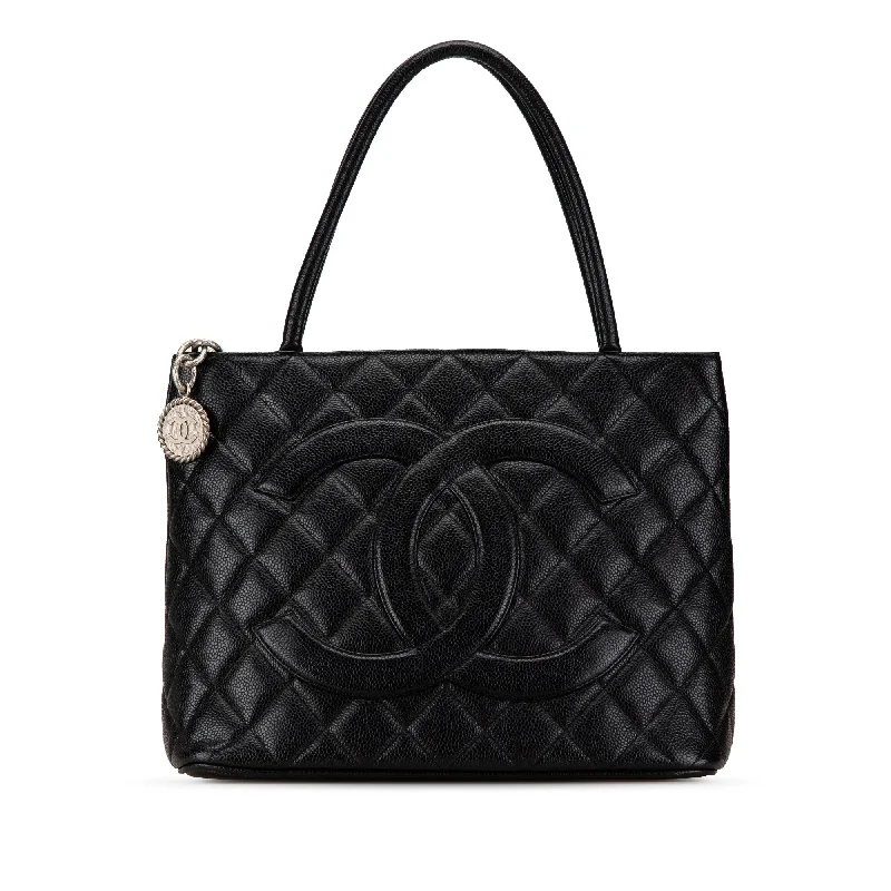 Chanel bags with iconic gold chainsBlack Chanel Caviar Medallion Tote