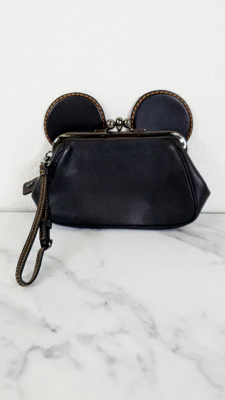 Coach Rogue bags with a monogram - embossed leather surfaceDisney x Coach Mickey Ears Clutch Wristlet in Black Glovetanned Leather - Coach 65794