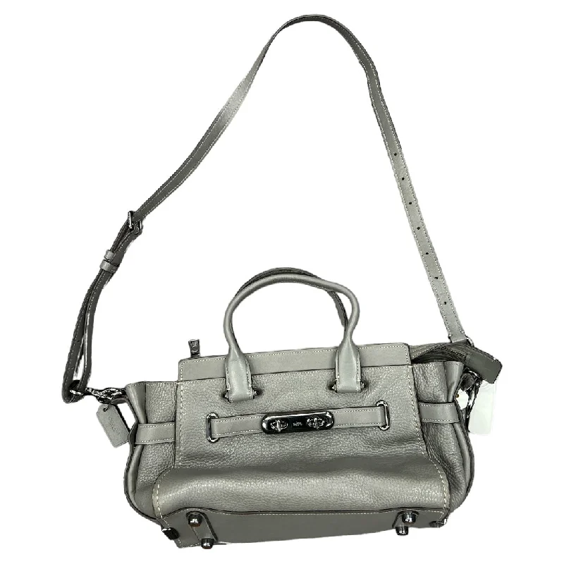 Ladies Coach handbags with a detachable wallet insert for added convenienceHandbag Designer By Coach  Size: Medium